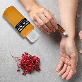 AromaZen roll-on being applied to wrist for long-lasting personal scent
