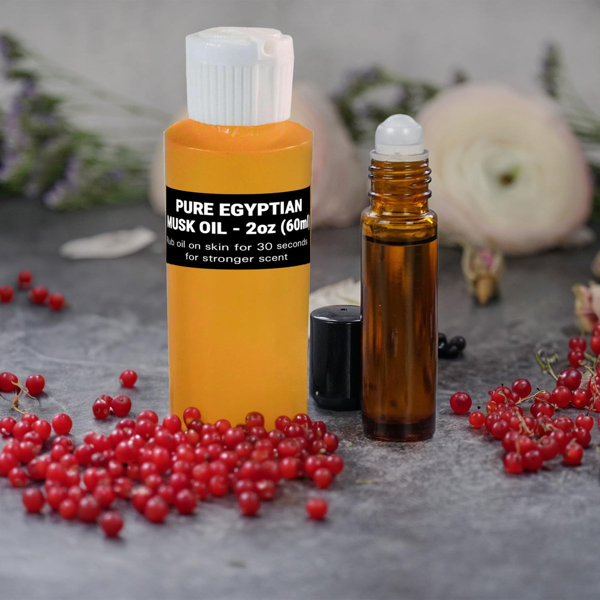 AromaZen 16oz bottle next to 10ml roll-on showing refill value and portability