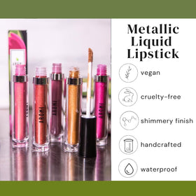 Aromi lipstick held in hand to show size and easy portability benefit: travel-friendly tube