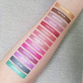 Aromi arm swatch showing vibrant magenta payoff and shimmer benefit: true-to-color preview