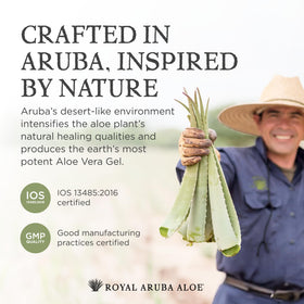 Aruba Aloe 6 oz bottle beside common items to show travel-friendly size