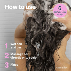 ATTITUDE applying bar to wet scalp to show gentle cleansing action