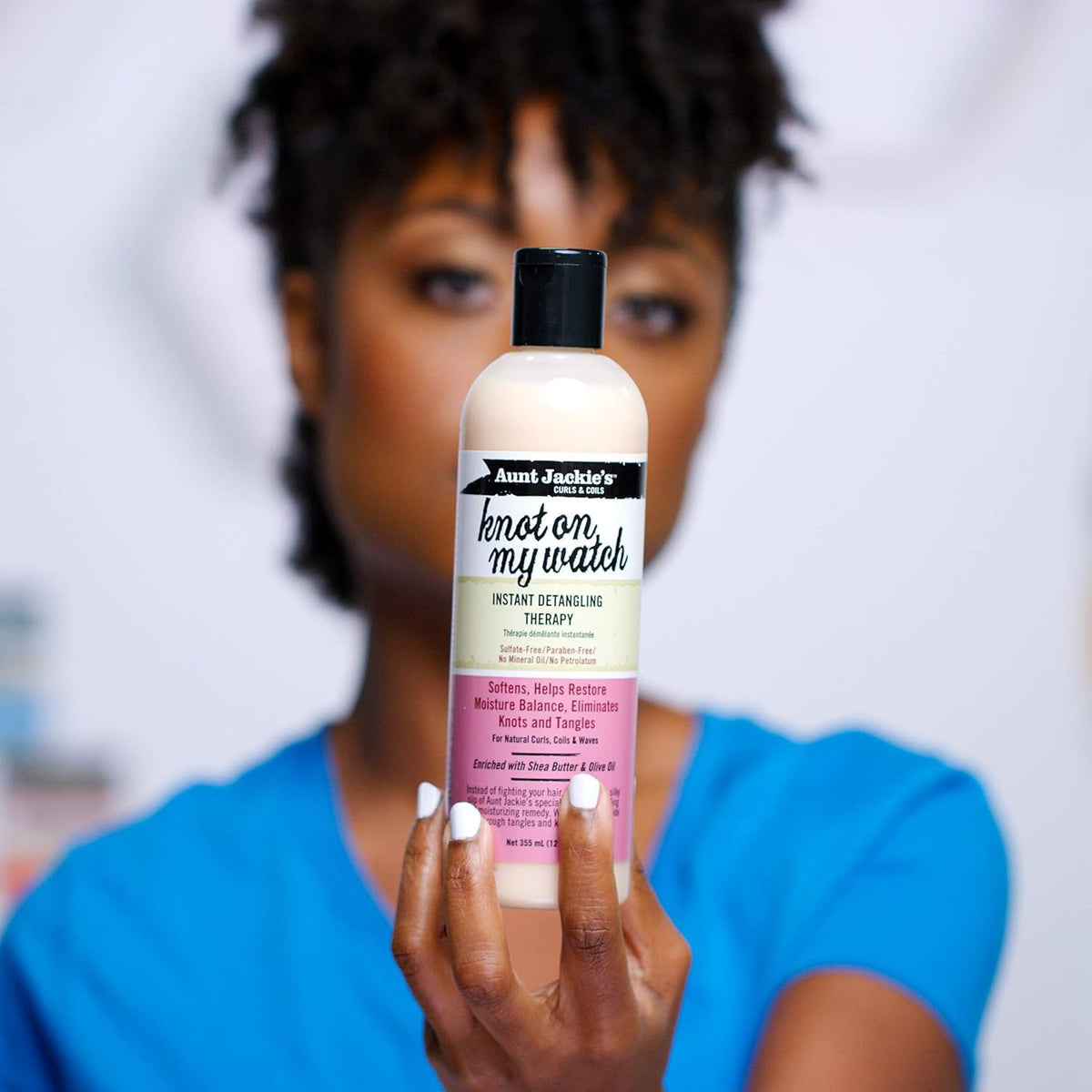 Aunt Jackie's cream texture close-up showing smooth slip for easier detangling