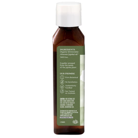 Aura Cacia close-up label and cap highlighting organic certification benefit