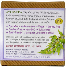 Auromere conditioner bar in hand demonstrates travel-friendly size and spill-free convenience