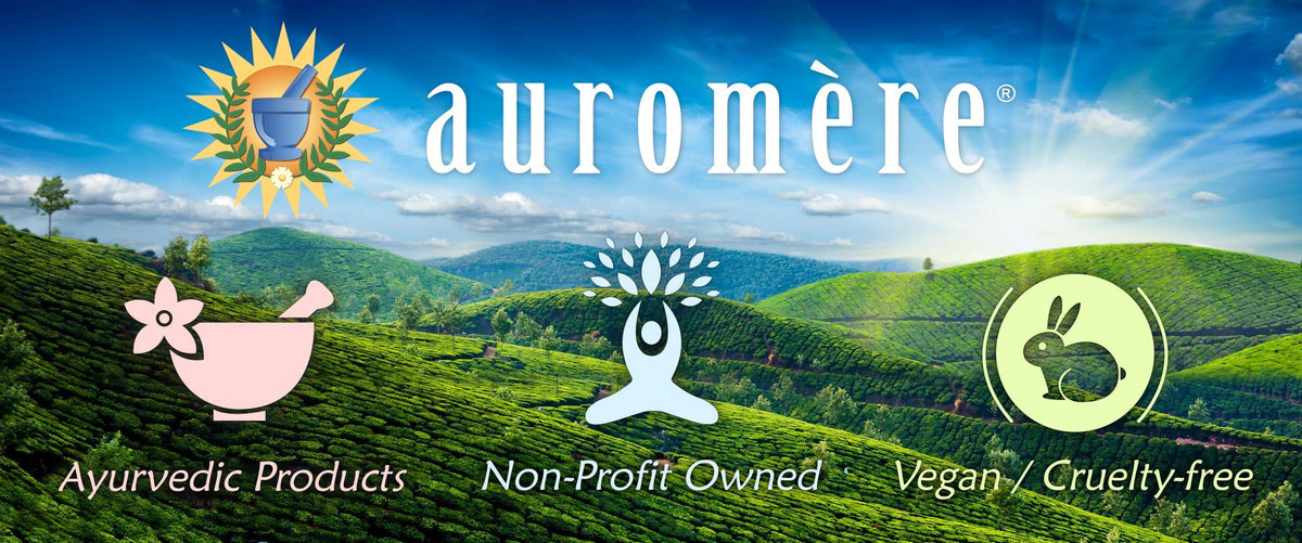 Auromere bar held in hand showing size and travel-friendly benefit