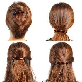 AURORA PIN clip holding a bun in place demonstrating reliable all-day hold