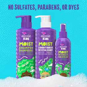 Aussie kids child combing hair easily using detangler for tear-free styling