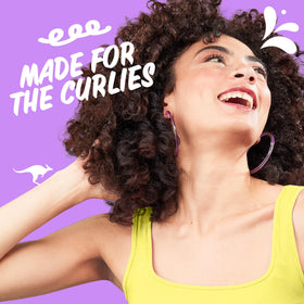 Aussie curl refresher gel being applied to revive curl definition