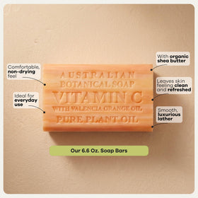 Australian Botanical Soap bar next to hand to show 6.6 oz scale and practical size