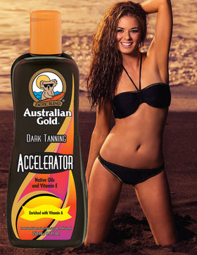 Australian Gold bottle placed on a beach towel evoking outdoor tanning use