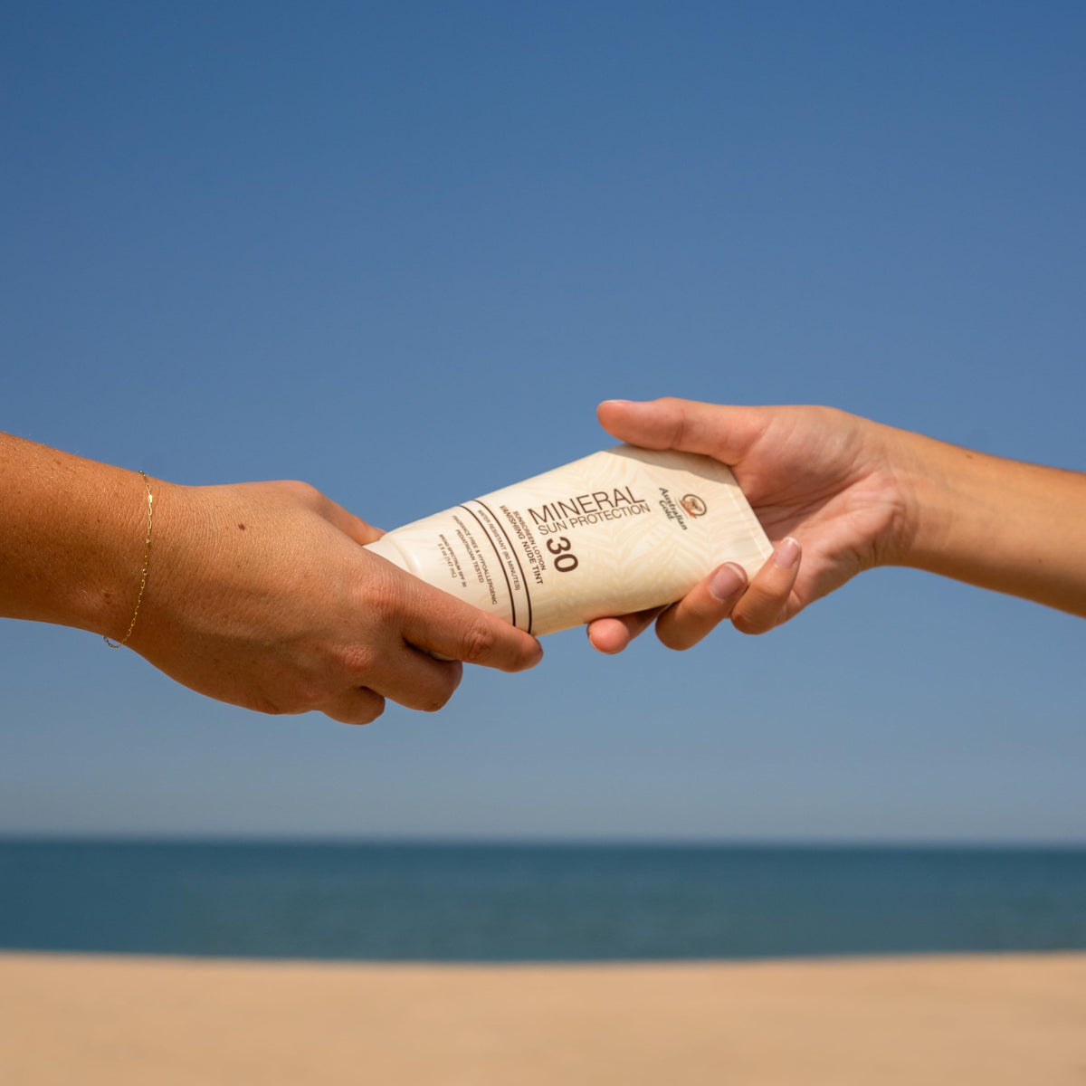 Australian Gold applied to family at beach highlighting gentle family protection