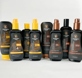 Australian Gold oil being sprayed on shoulder for faster tanning
