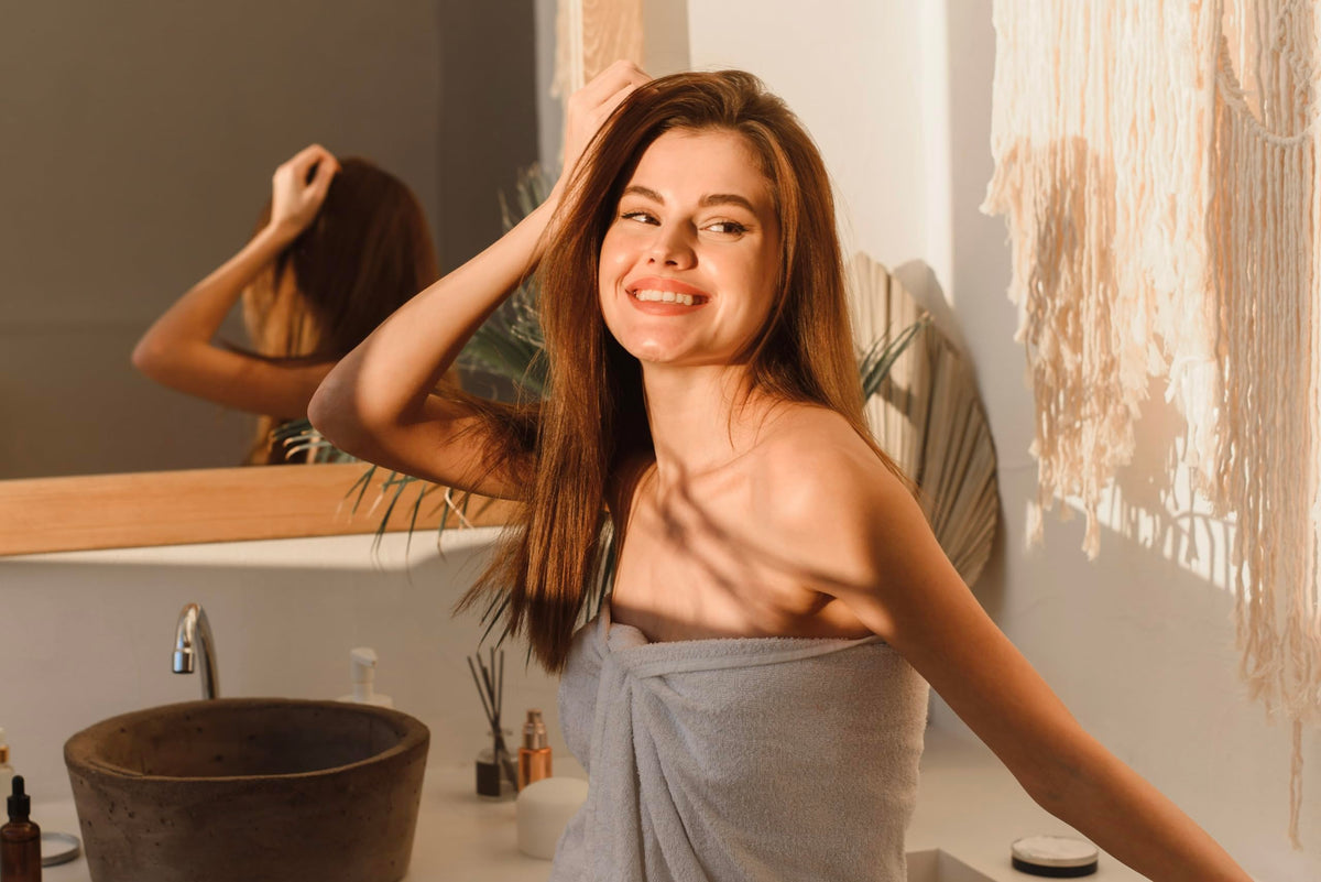 Australian Gold products staged on vanity for a citrus champagne bath routine
