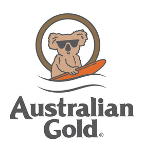 Australian Gold bottle on beach towel conveying tropical fragrance benefit