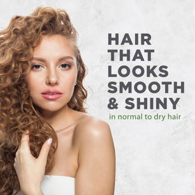 Avalon Organics creamy conditioner texture dispensed to show moisturizing slip