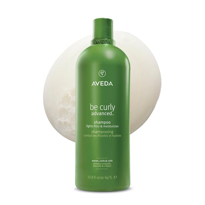 Aveda bottle front view showing Be Curly Advanced Shampoo for defined curls
