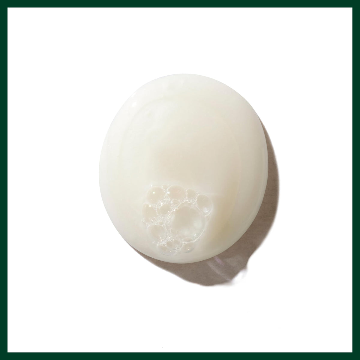 Shampoo in shower with hand applying Aveda for easy detangling benefit