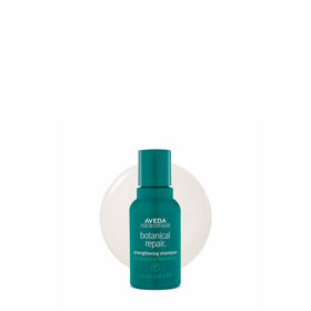 Aveda bottle front packaging showing product name and compact travel size benefit