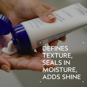 Close-up of Aveda Brilliant cap and dispenser, shows easy controlled dispensing