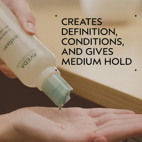 Aveda Confixor pump and label closeup highlighting scent and ingredient transparency benefit
