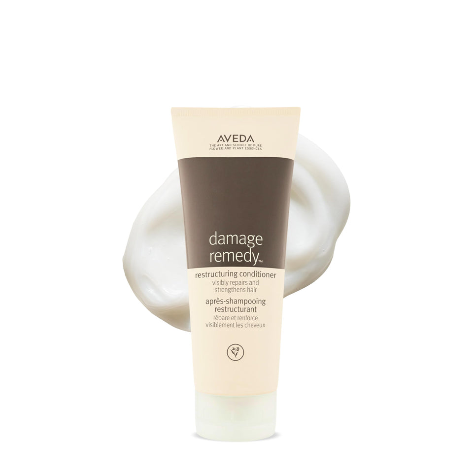 Aveda bottle front packaging showing brand and repair benefit