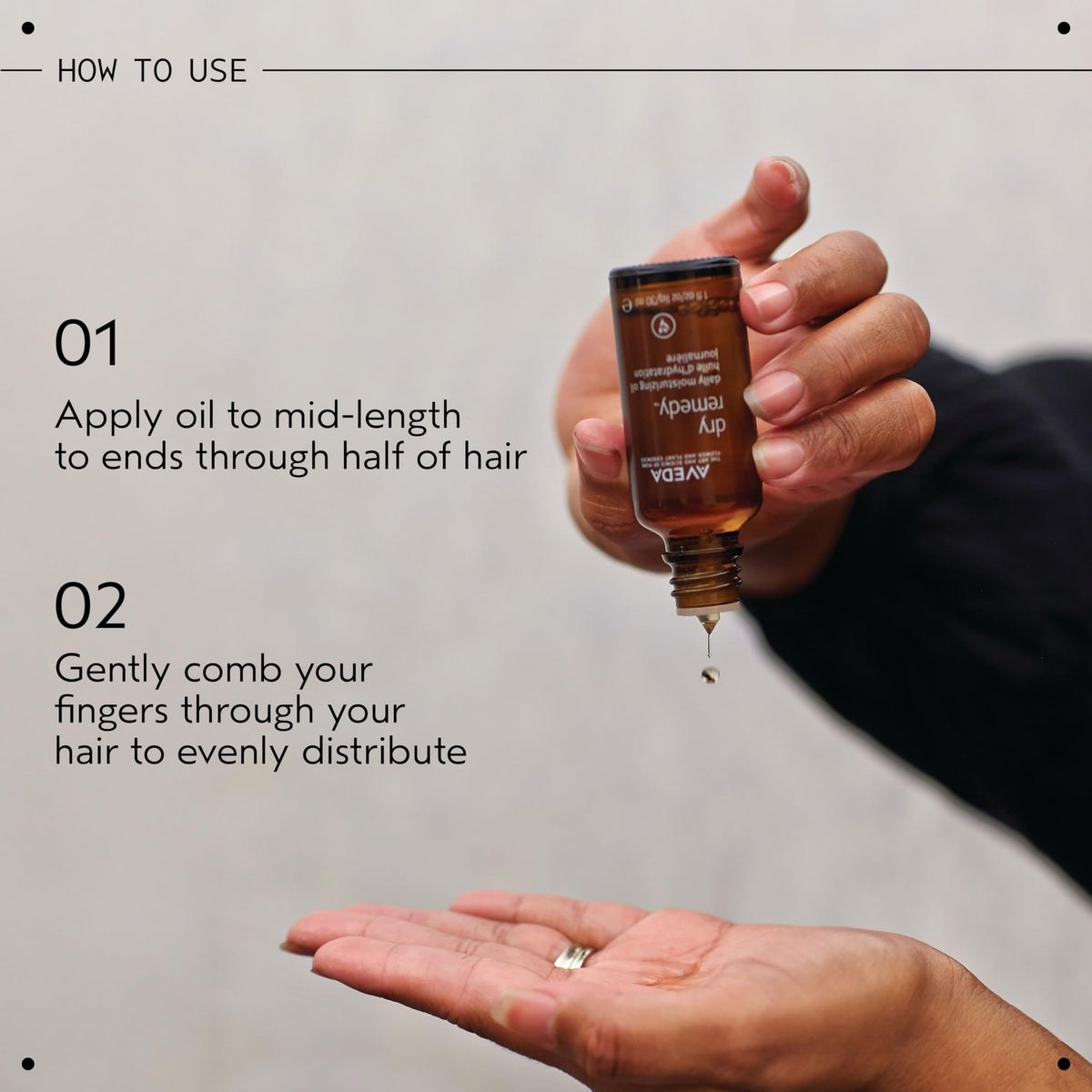 Aveda Dry Remedy bottle in hand to show 1 fl oz size and portability