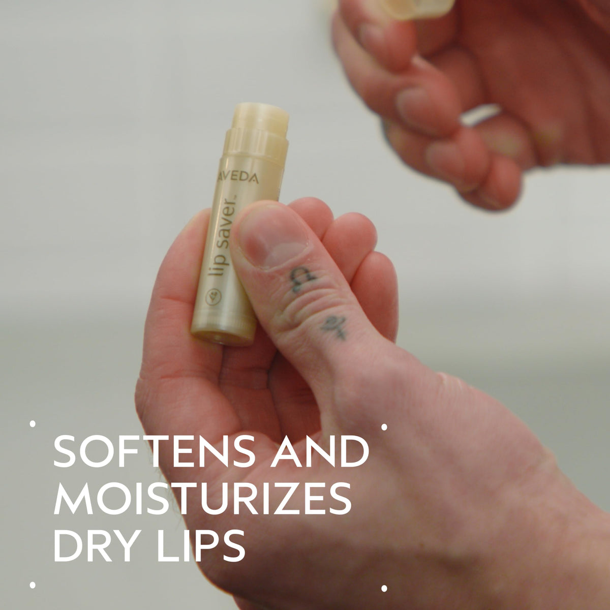 Aveda Lip Saver smooth balm texture close-up highlighting creamy finish and quick absorption benefit