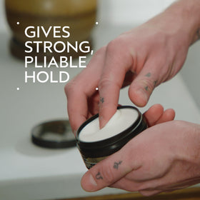 Aveda Men open jar revealing clay texture, brand control and grip
