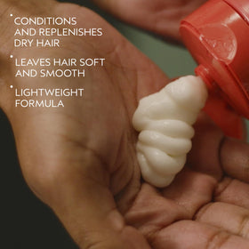Aveda conditioner texture on hand demonstrating lightweight absorption benefit