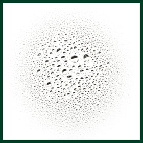 Aveda spray applied to parted hair demonstrating targeted oil control