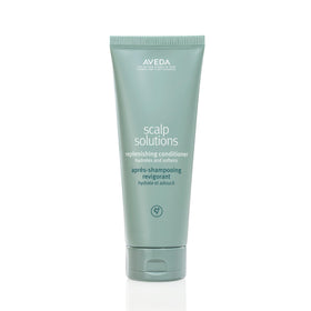 Aveda bottle front view showing clean packaging and product name benefits