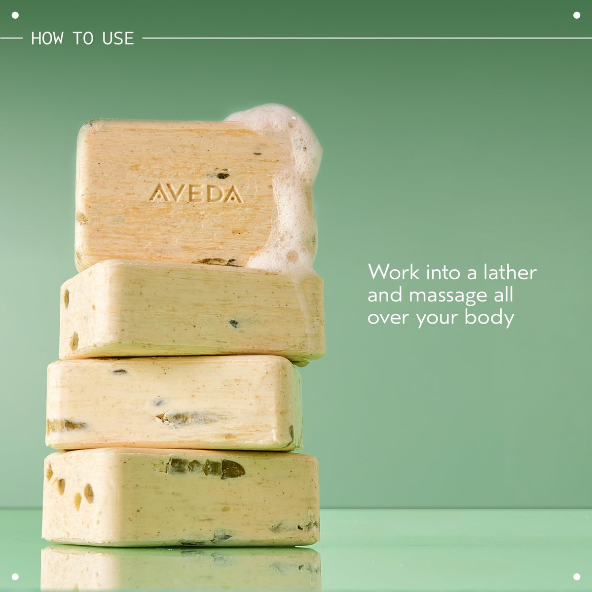 Aveda bar beside a hand for scale and long-lasting hard-milled benefit