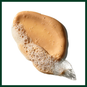 Aveda sap moss bottle next to hand showing 6.7 fl oz scale