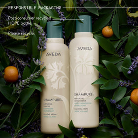 Aveda Shampure on a bathroom shelf lifestyle shot conveying calming aroma and daily ritual