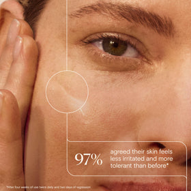 Aveeno moisturizer on hand being smoothed in showing lightweight finish