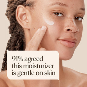 Applying Aveeno moisturizer to cheek for easy daily protection