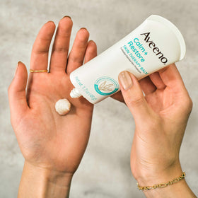 Aveeno balm with oats visual highlighting colloidal oatmeal calming benefit