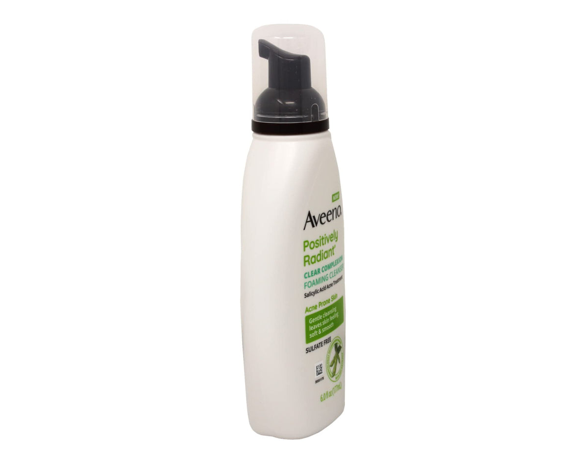 Aveeno bottle in hand showing 6 oz scale and portability