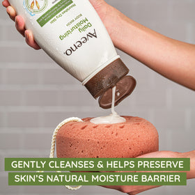 Aveeno body wash in use on arm showing gentle cleansing benefit