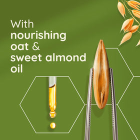 Aveeno texture close-up pouring to display creamy oil absorption benefit