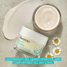Aveeno products beside passport showing TSA-friendly travel sizes