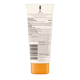 Aveeno bottle next to travel bag highlighting TSA-compliant convenience