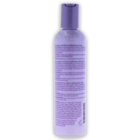 Avlon Affirm applied to hair during relaxer service illustrating moisture and ease of combing