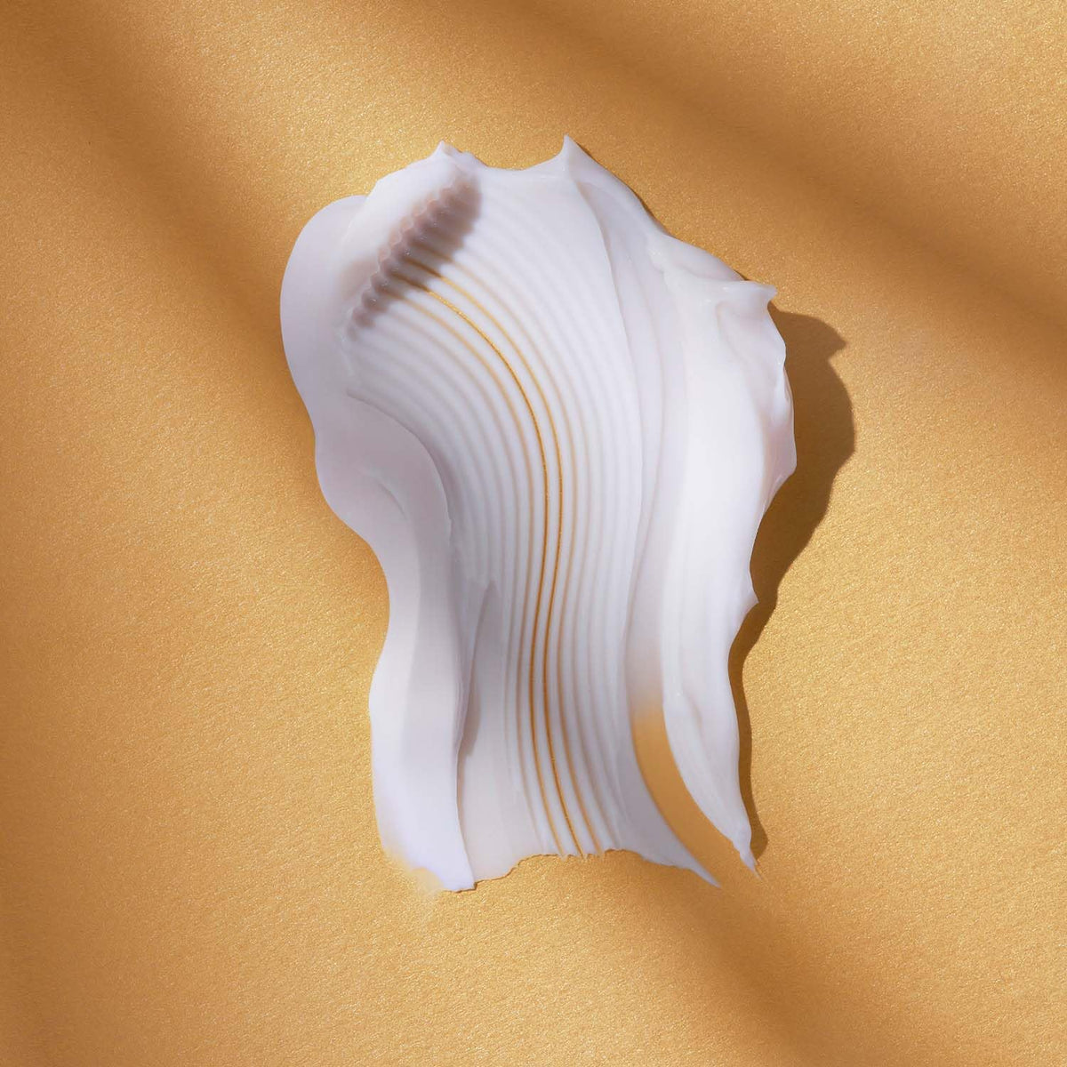 AVON Anew cream on palm demonstrating lightweight spreadability
