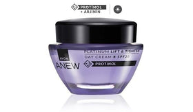 AVON SKIN SO SOFT on bathroom vanity with towels, visible benefit: effortless daily routine