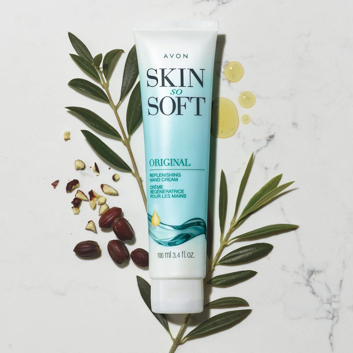 avon closeup of tube nozzle with jojoba oil graphic highlighting nourishing ingredient