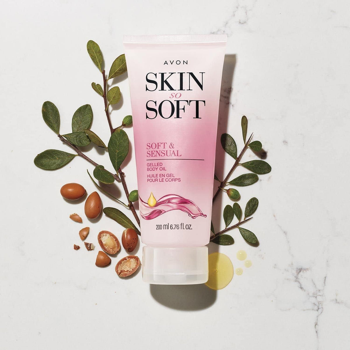 AVON Skin So Soft applied to hand demonstrating smooth non-greasy feel and glow