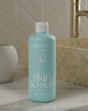 AVON lotion spread on forearm closeup illustrating smooth finish and non-greasy feel