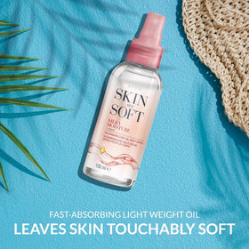 AVON SKIN SO SOFT spray in action misting skin for quick hydration
